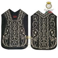 Emblematik by Pasamanerias y Bordados black silk Roman chasuble featuring intricate silver floral embroidery